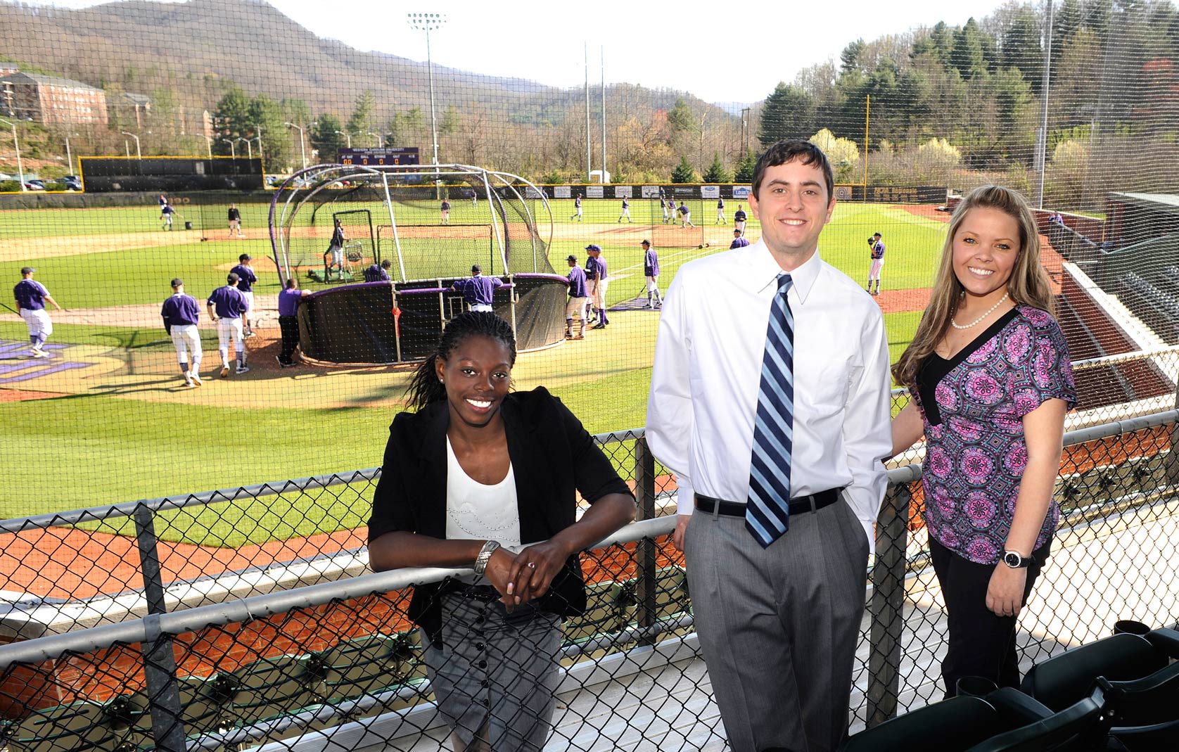  Sport Management students in front of baseball field