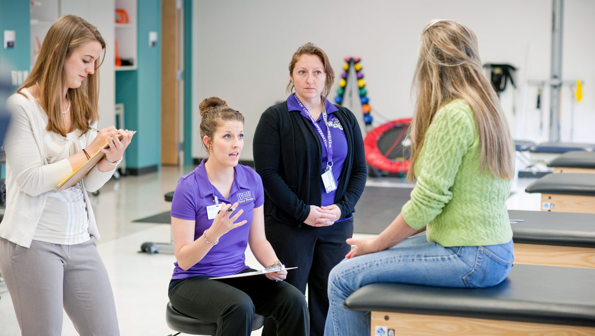 Students working in the physical therapy clinic